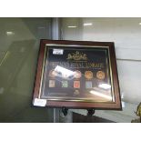 A framed and glazed display 'The Royal Centenary Collection Of Britain's Royal Lineage - A Century