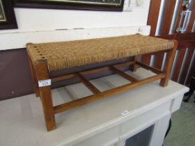 A mid-20th century oak seagrass seated stool