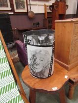 A metal waste paper basket with Marilyn Monroe transfer print