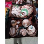 Two trays of decorative ceramic tableware to include plates, serving bowls, etc