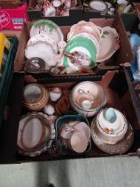 Two trays of decorative ceramic tableware to include plates, serving bowls, etc