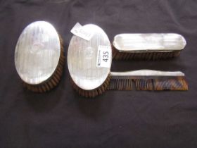 Three silver hallmarked brushes together with a silver hallmarked comb