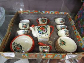 A boxed oriental ceramic six place tea set with floral decoration