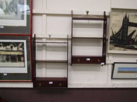 Two reproduction mahogany wall mounted shelving units with drawer