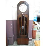 An early 20th century oak dome topped long case clock Unsure of working order, lacking key, advise