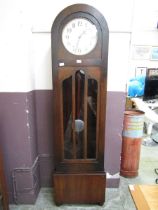 An early 20th century oak dome topped long case clock Unsure of working order, lacking key, advise