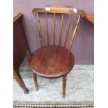 An early 20th century penny seated spindle back chair