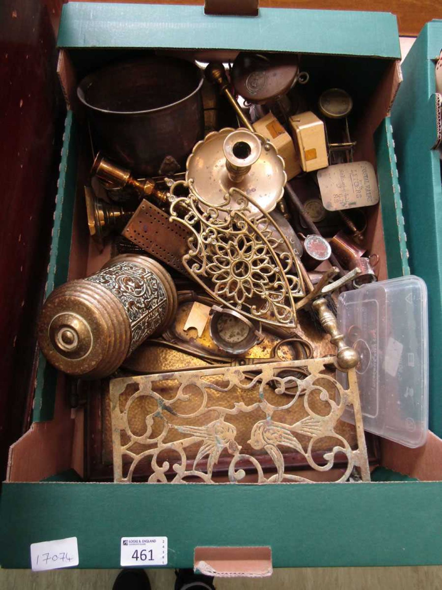 A tray containing a quantity of brass and metalware to include trivet stand, scales, etc