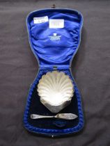 A silver hallmarked shell design dish together with a small knife, approx. weight 38g contained in
