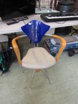 A mid-20th century design chair having a blue Perspex back on metalwork base