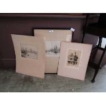 A selection of framed and unframed etchings of buildings