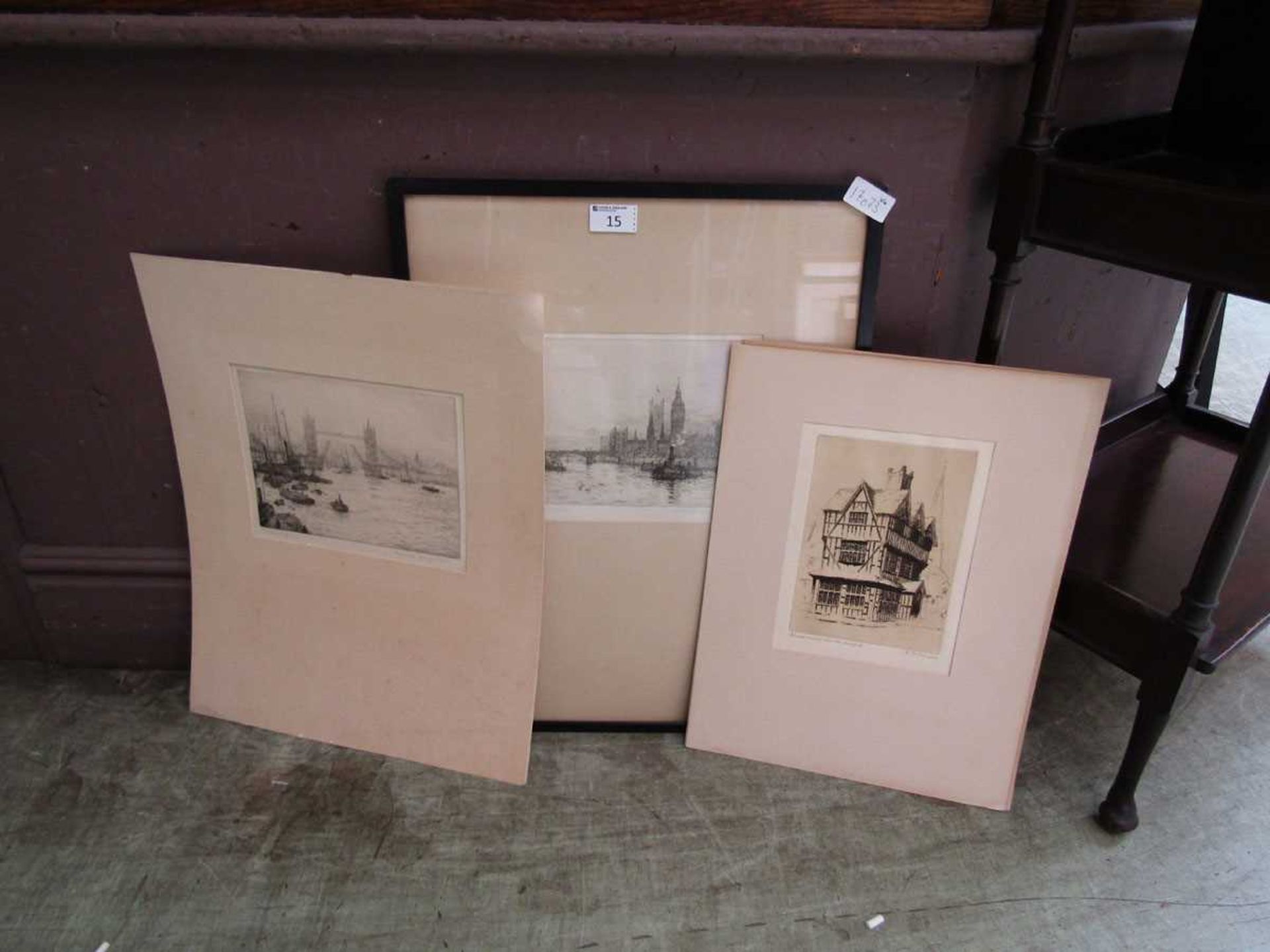 A selection of framed and unframed etchings of buildings