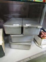 Four industrial stainless steel catering tins