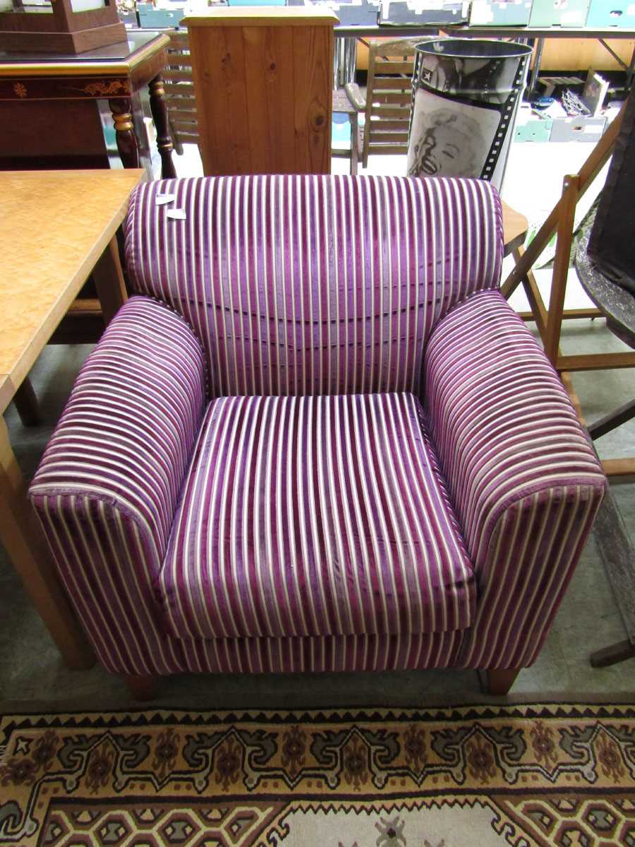 A modern purple striped upholstered easy chair