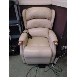 A cream leather upholstered electric rise and recline chair