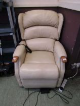 A cream leather upholstered electric rise and recline chair