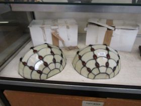 A pair of reproduction Tiffany style wall lights with boxes