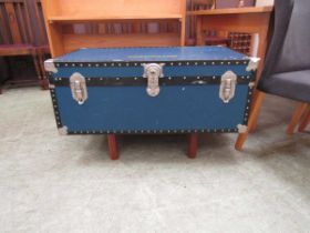 A banded blue fibre travelling trunk, later converted to coffee table