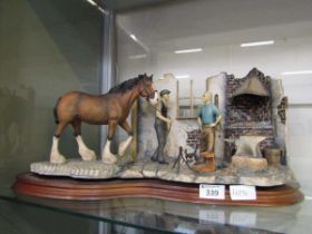 A classic Border Fine Arts model of farmer and horse at farrier's One very small break to leg of