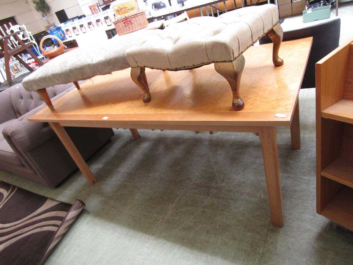 A modern bird's eye maple effect topped folding dining table