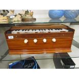 An early 20th century travelling harmonium organ (A/F)