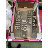 A tray containing four early 20th century cast metal railway signs