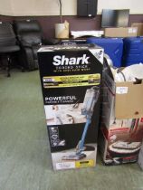 +VAT A boxed Shark corded stick vacuum