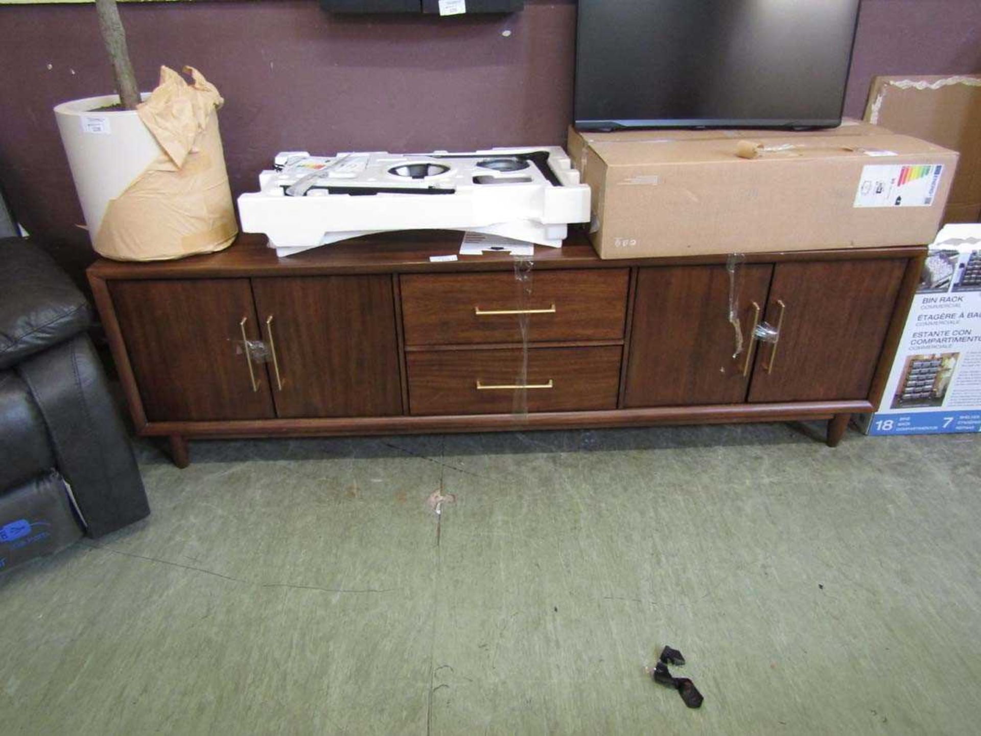 +VAT A modern mahogany effect sideboard having two drawers flanked by cupboard doors
