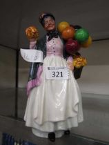 A Royal Doulton ceramic figurine 'Biddy Penny Farthing' HN1843