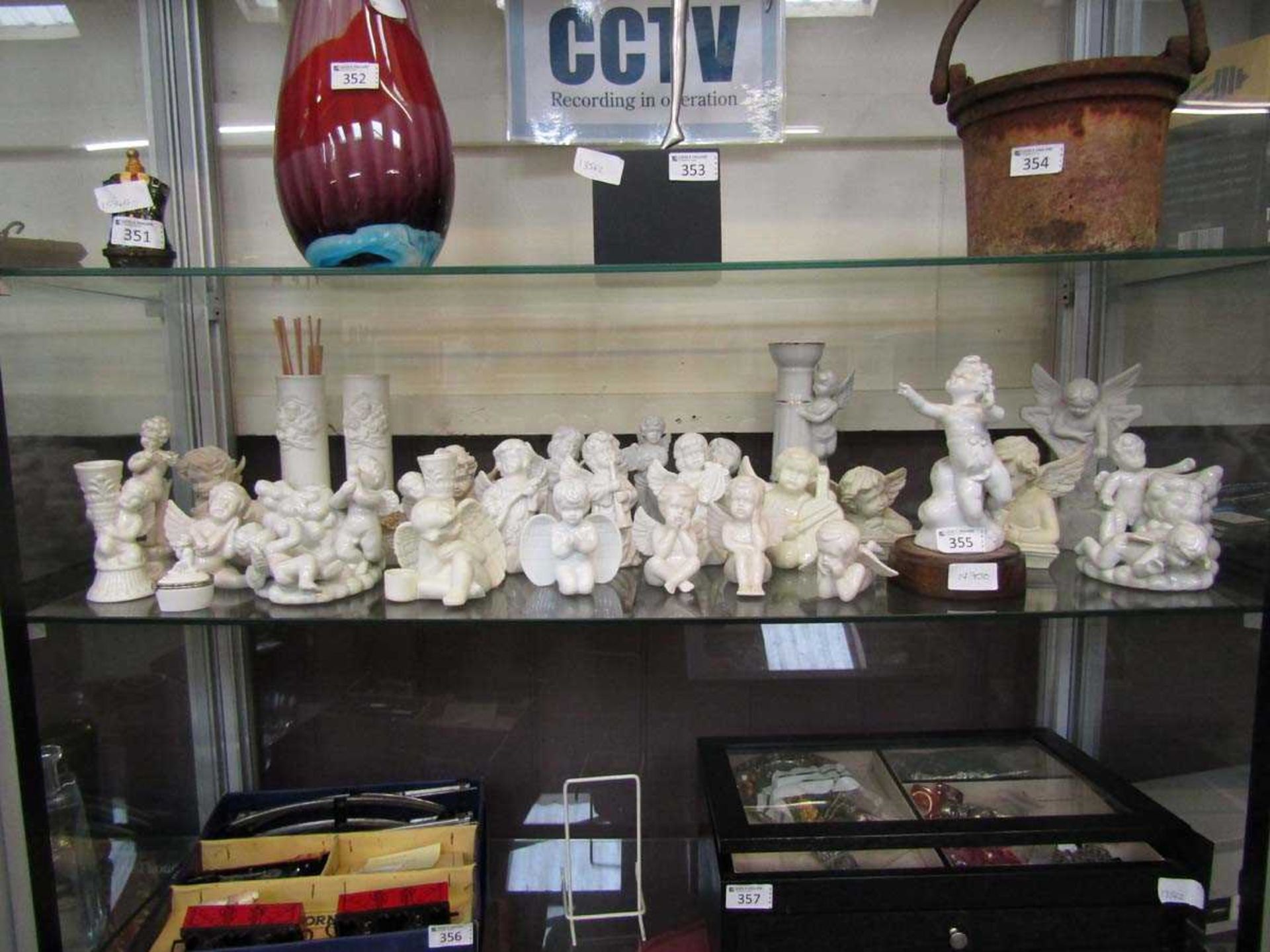 A large quantity of white ceramic cherubs, etc