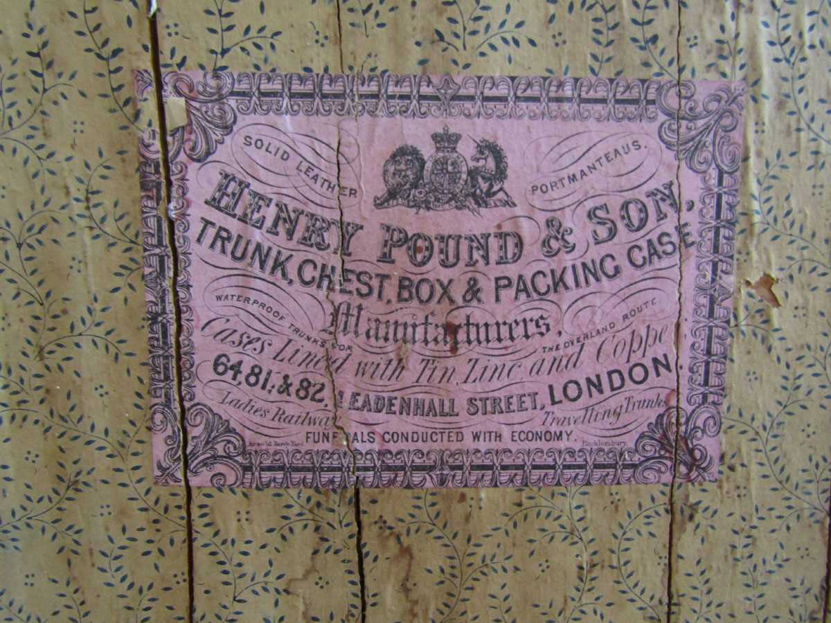 A 19th century wooden, oil skin and metalwork travelling trunk by retailer Henry Pound and Sons - Image 2 of 3