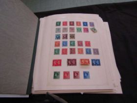 A stamp album containing a quantity of mainly British stamps