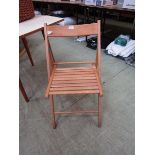 A beech folding slatted seated chair