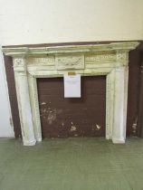 A marble effect fire surround (A/F) We believe the fire surround is most likely made of plaster.