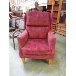 A salmon pink upholstered HSL wing Fireside Eltham Grande Armchair Provides amazing comfort where