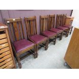 A set of six mid-20th century high back dining chairs with drop-in seats