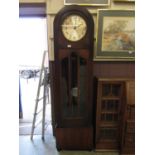 An early 20th century long case clock with eight-day movement chiming on eight gongs