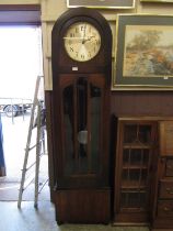 An early 20th century long case clock with eight-day movement chiming on eight gongs