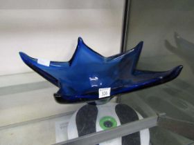 A modern blue glass bowl in the form of a star