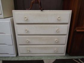 A cream painted chest of four drawers