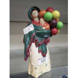 A Royal Doulton ceramic figurine 'The Balloon Seller' HN583