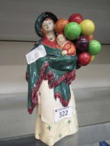 A Royal Doulton ceramic figurine 'The Balloon Seller' HN583