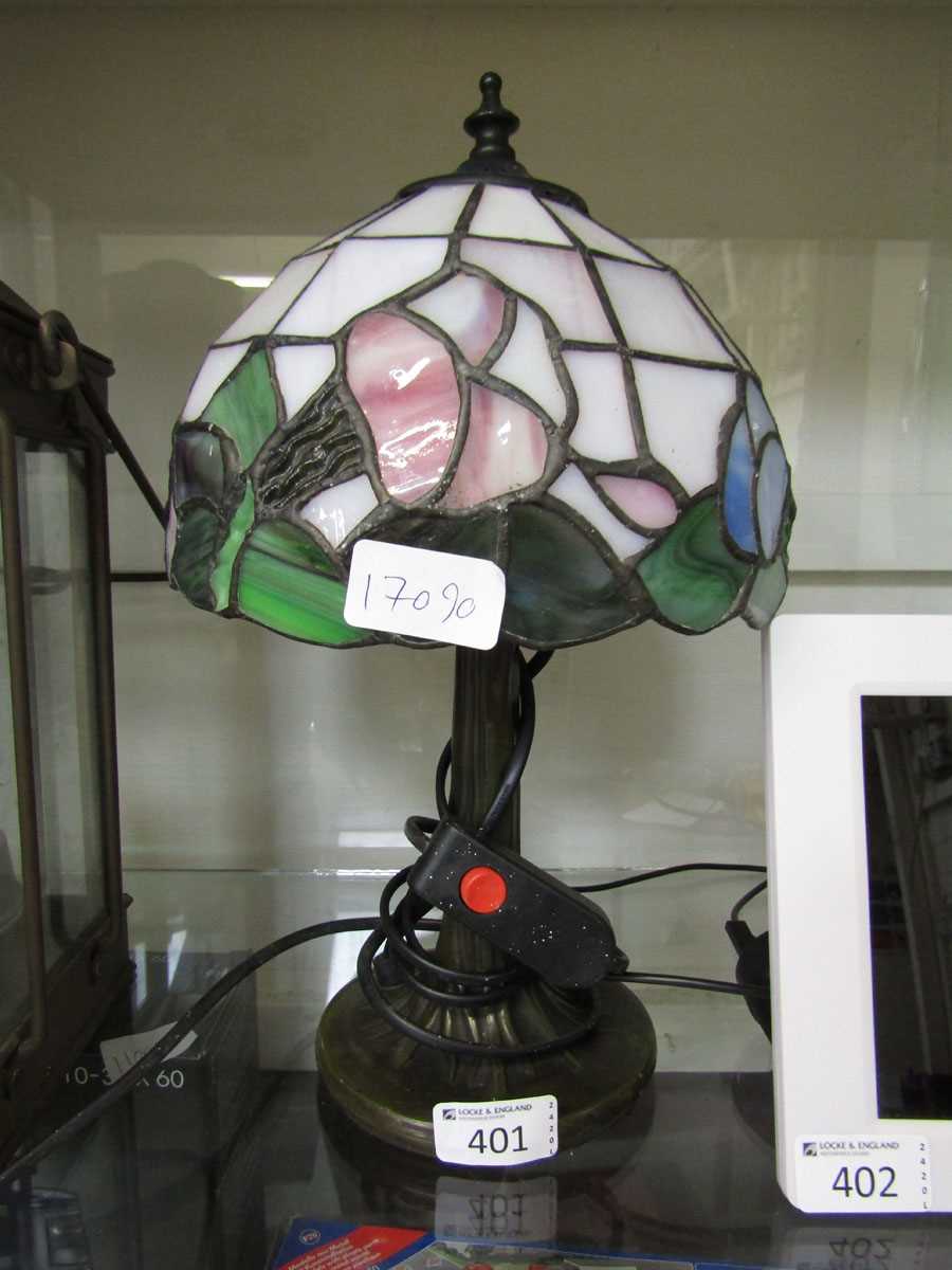 A small reproduction Tiffany style table lamp