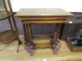 A nest of three oak occasional tables
