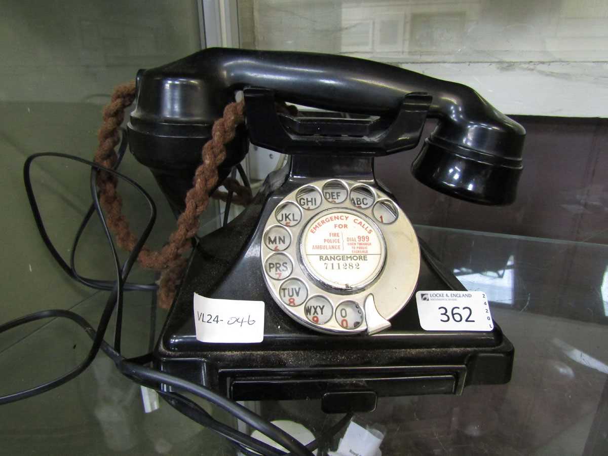 A black Bakelite telephone