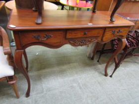 A reproduction walnut console table having three drawers on cabriole supports Dimensions: H,