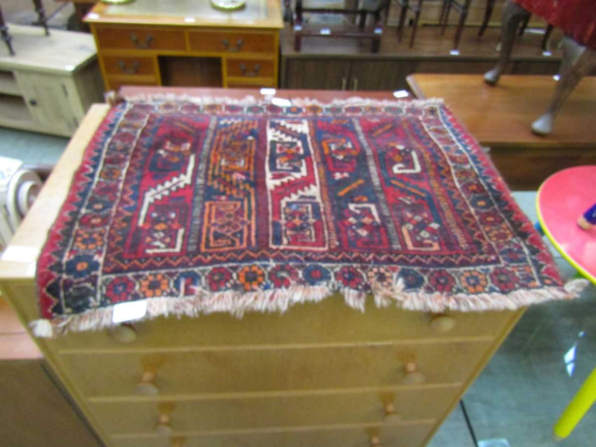 A small red ground eastern prayer rug