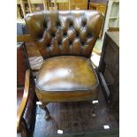 A child's reproduction early 20th century leather upholstered chair