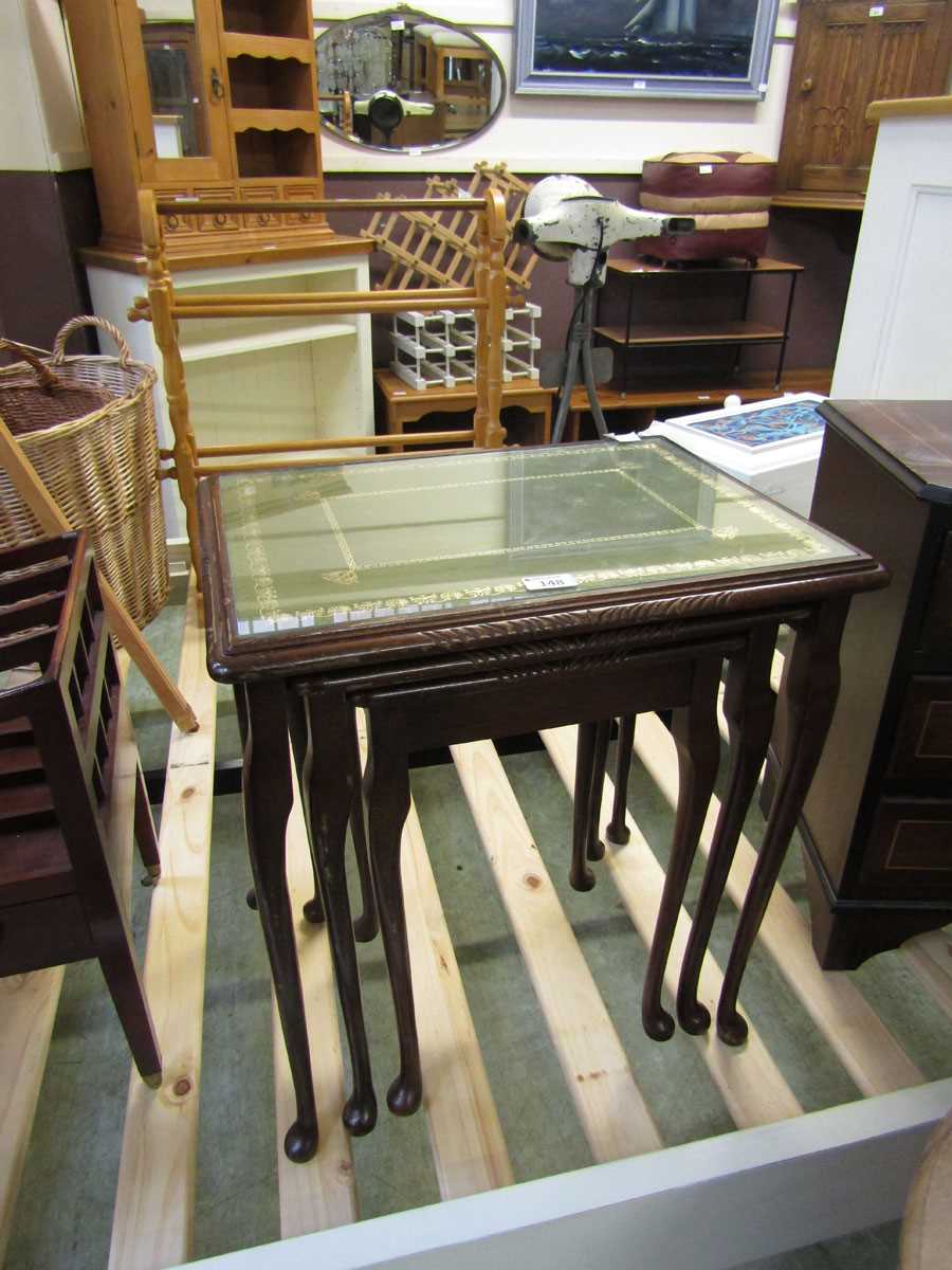 A nest of three reproduction walnut occasional tables