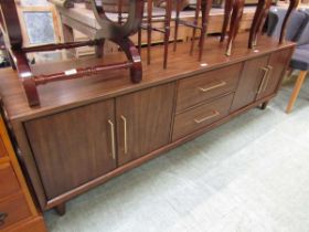 A reproduction mid-20th century design sideboard having two drawers flanked by cupboard doors
